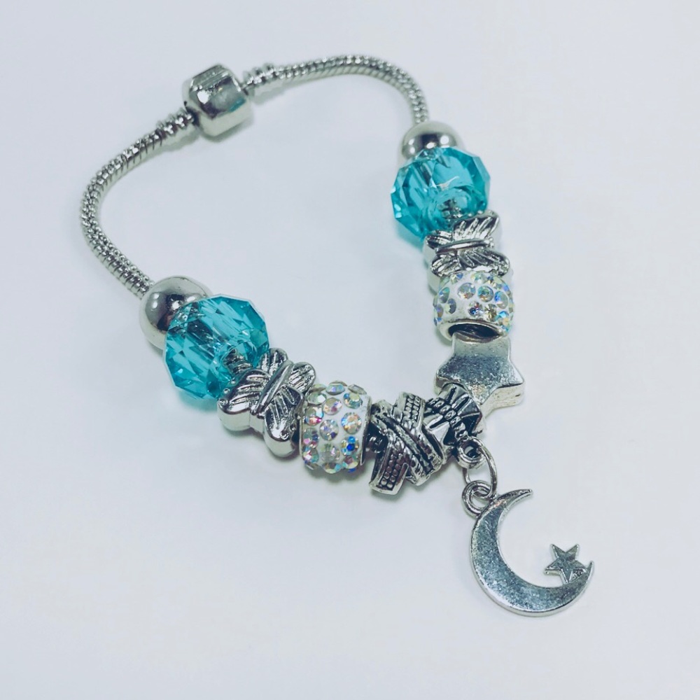 Silver bracelet with turquoise crystal moon charm